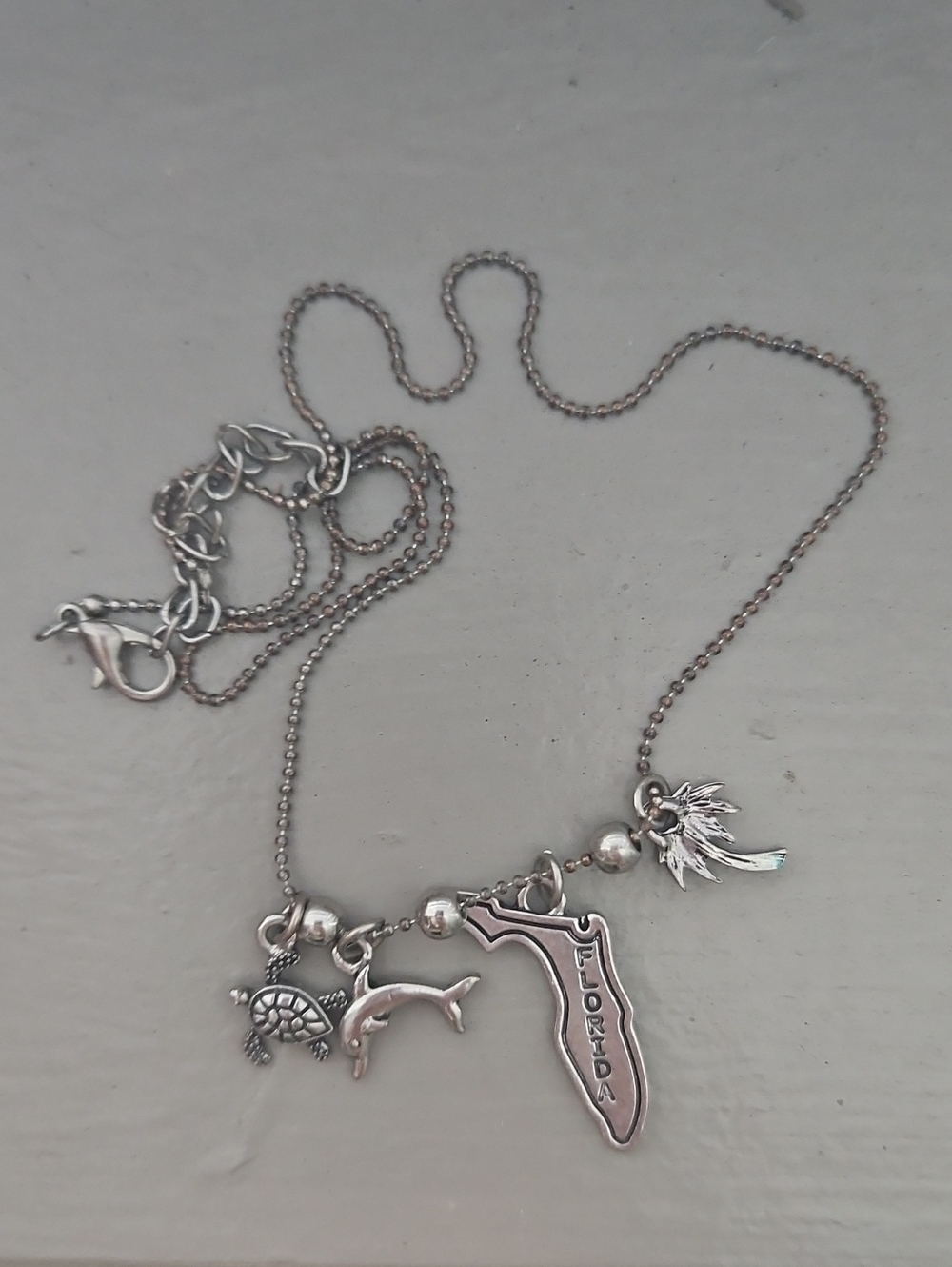 Silver Florida Charm Necklace with Turtle, Dolphin & Palm Leaf